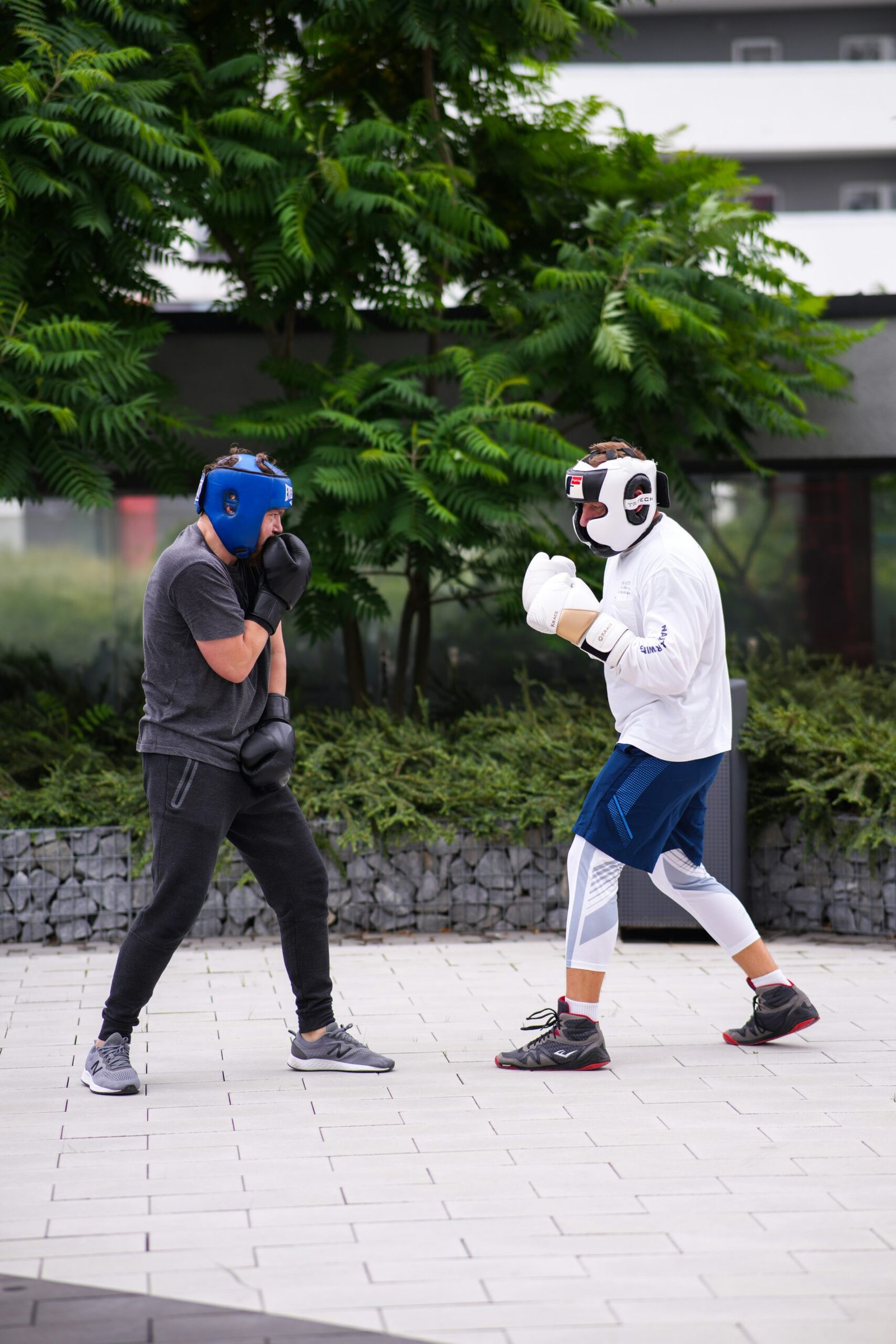 A man wearing a mask and boxing gloves